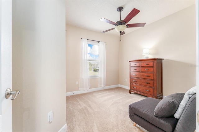 sitting room with light carpet and ceiling fan