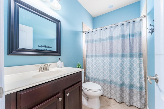 bathroom featuring vanity, walk in shower, tile patterned flooring, and toilet