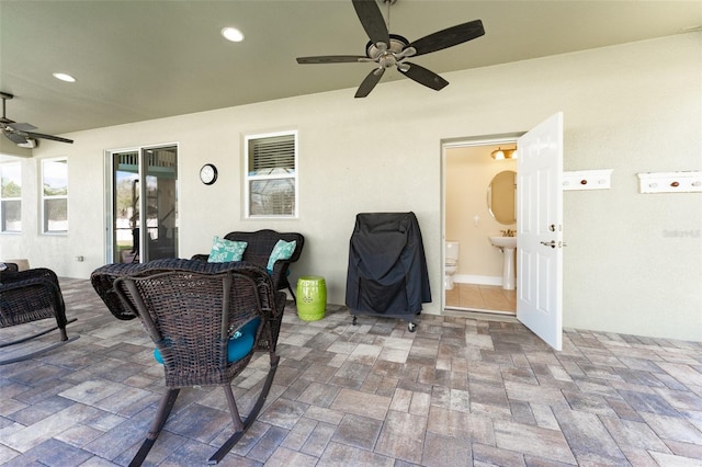 view of patio with ceiling fan