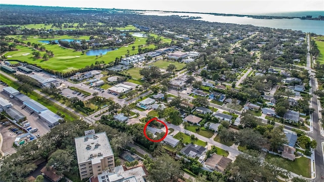 aerial view featuring a water view and golf course view