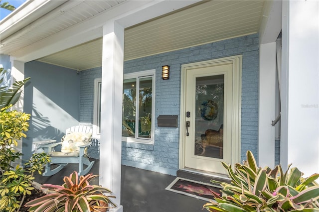 doorway to property featuring a porch