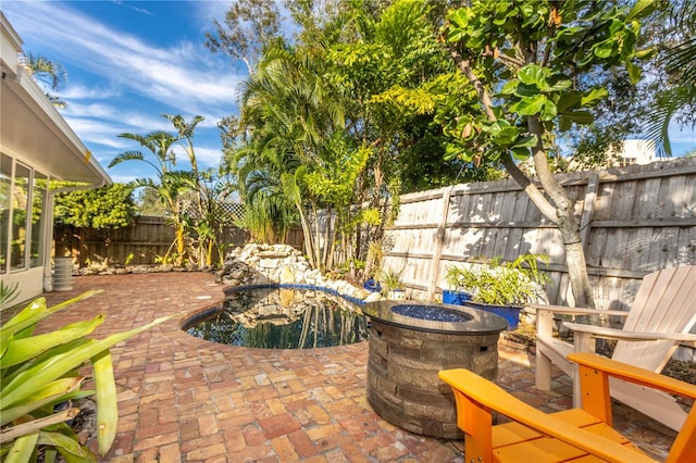 view of patio / terrace featuring a fire pit