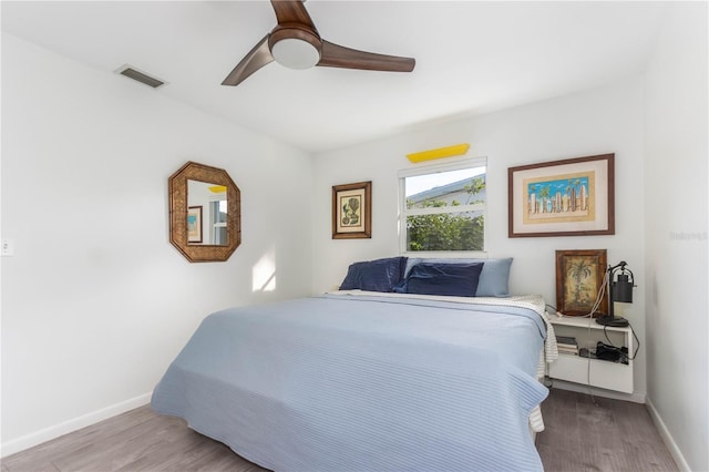 bedroom featuring wood-type flooring and ceiling fan