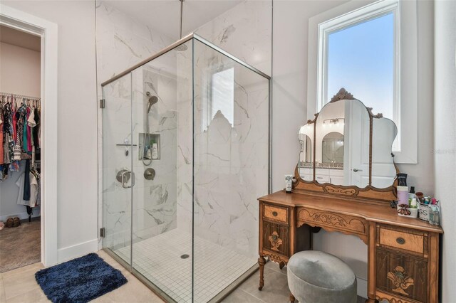 bathroom with vanity, tile patterned floors, and walk in shower