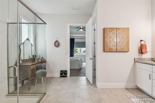 bathroom with ceiling fan, tile patterned flooring, vanity, and an enclosed shower