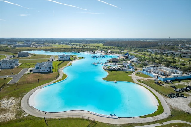 view of swimming pool featuring a water view