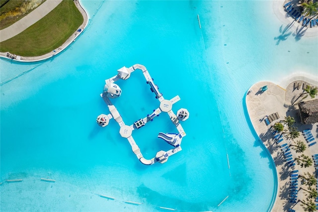 view of pool with a water view