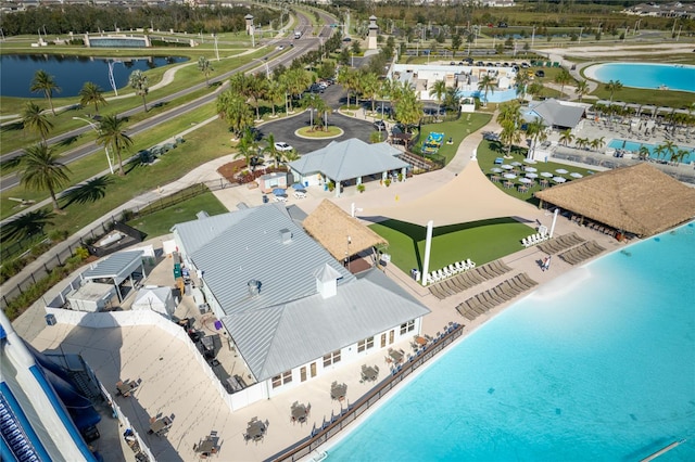 birds eye view of property with a water view