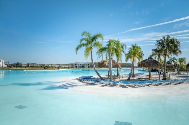 view of pool with a water view