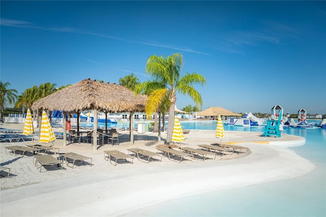 view of home's community with a gazebo and a water view