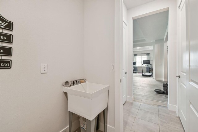 bathroom featuring tile patterned flooring and sink