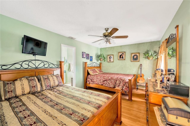 bedroom with hardwood / wood-style flooring and ceiling fan