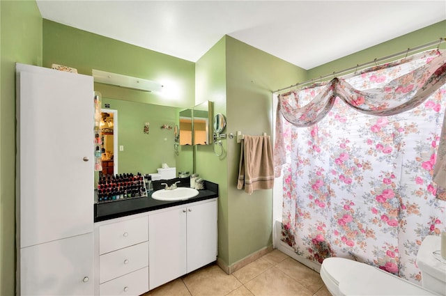 full bathroom featuring vanity, toilet, tile patterned floors, and shower / bath combo