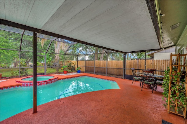 view of swimming pool with an in ground hot tub, a patio area, and a lanai