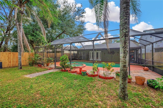 view of yard with a patio, a fenced in pool, and a lanai