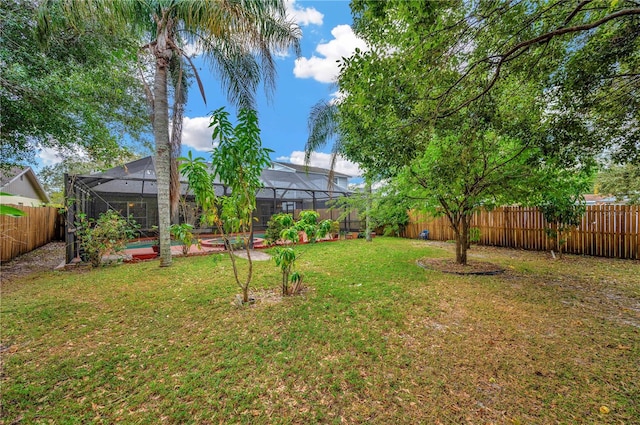 view of yard featuring glass enclosure