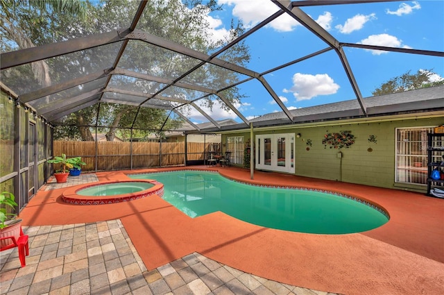 view of swimming pool with a patio, french doors, an in ground hot tub, and glass enclosure