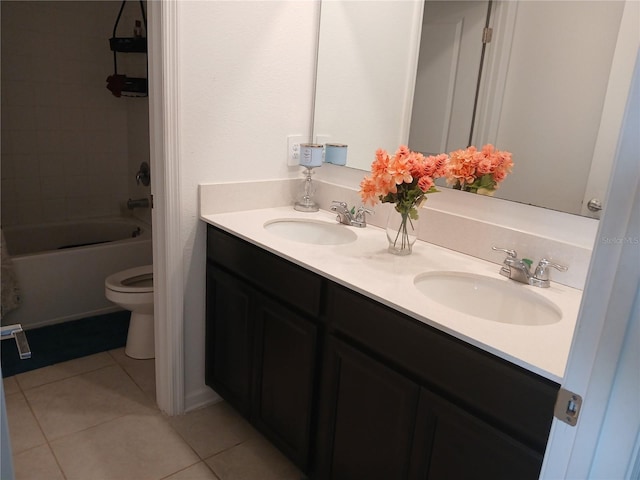 full bathroom featuring vanity, toilet, tile patterned flooring, and tiled shower / bath