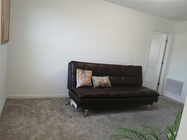 sitting room featuring light colored carpet