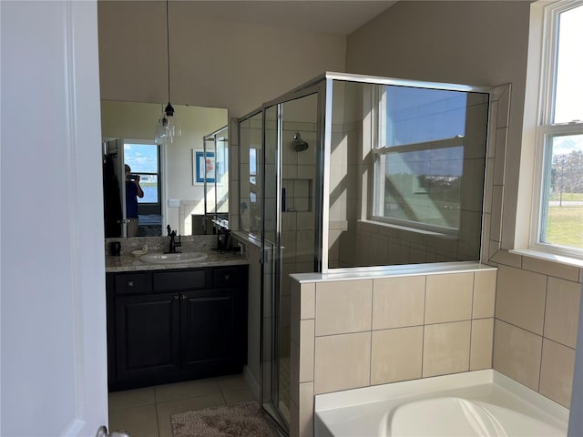 bathroom featuring vanity, an inviting chandelier, shower with separate bathtub, and tile patterned flooring