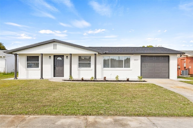 ranch-style house featuring a garage, central AC, and a front yard