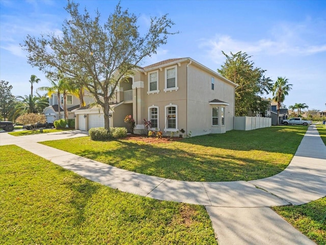 mediterranean / spanish house with a garage and a front lawn