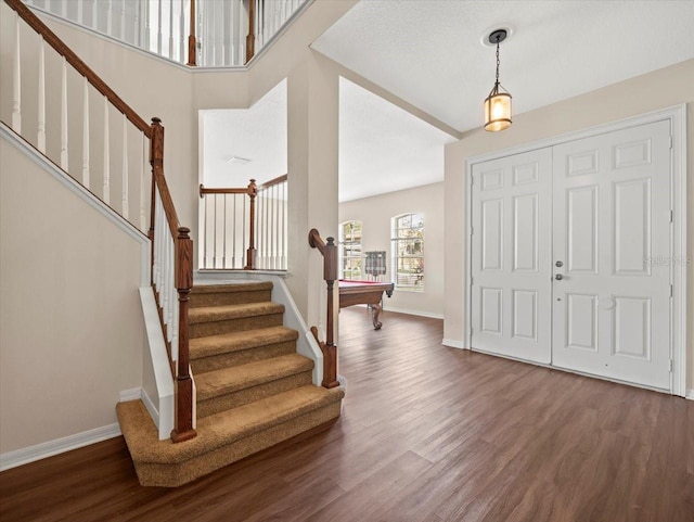 foyer entrance featuring dark hardwood / wood-style floors and billiards