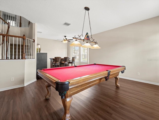 game room featuring pool table, bar area, a textured ceiling, ceiling fan, and hardwood / wood-style flooring