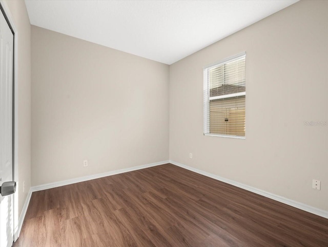 spare room featuring hardwood / wood-style floors