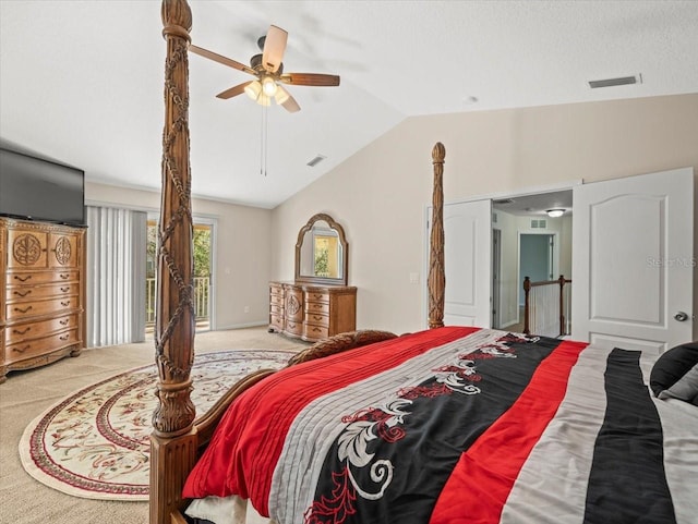 bedroom featuring light carpet, lofted ceiling, and ceiling fan