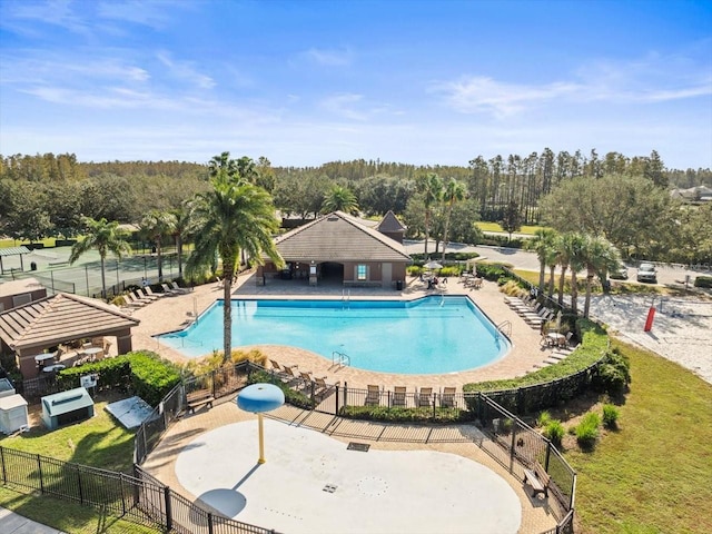 view of swimming pool featuring a patio area and a lawn