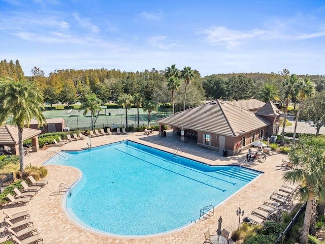 view of swimming pool with a patio