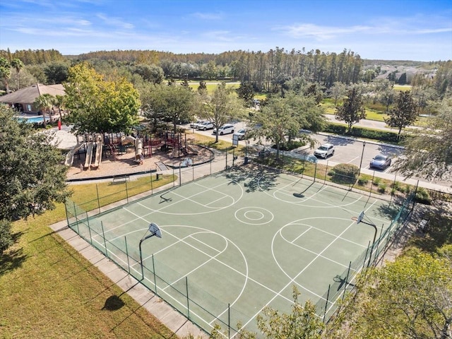 view of sport court with a playground