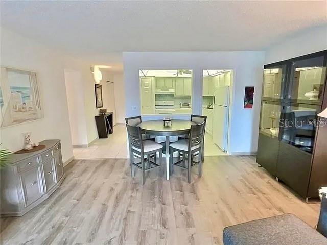 dining area featuring ceiling fan and light hardwood / wood-style floors