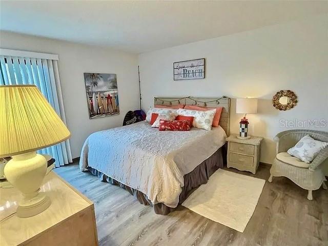 bedroom featuring wood-type flooring