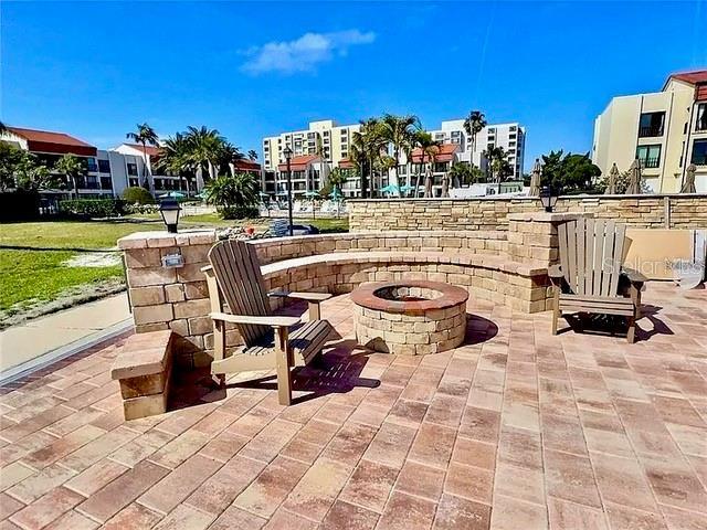 view of patio / terrace featuring an outdoor fire pit