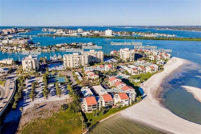 drone / aerial view with a water view and a beach view