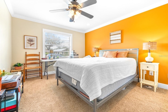 bedroom featuring crown molding, light carpet, and ceiling fan