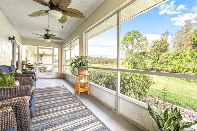 sunroom / solarium with ceiling fan