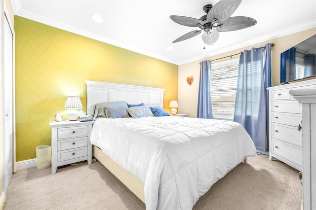 carpeted bedroom featuring crown molding and ceiling fan