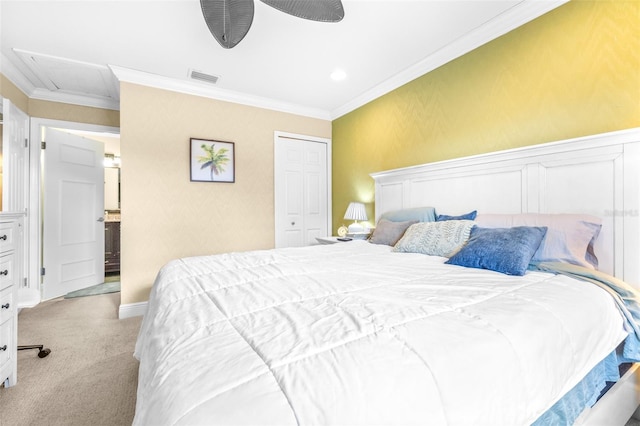 carpeted bedroom featuring ceiling fan, ornamental molding, and a closet