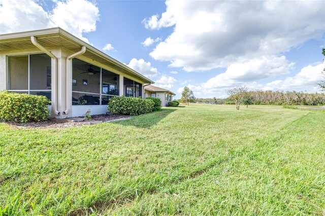 view of yard with a sunroom