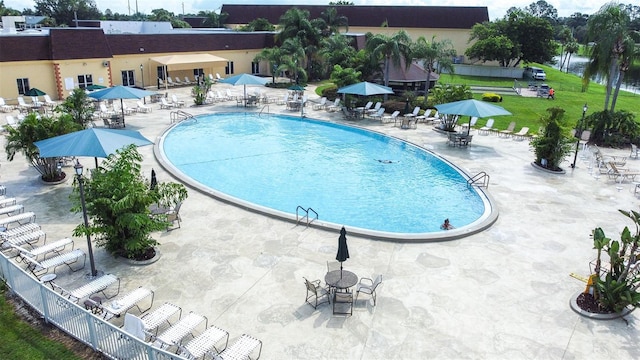 view of swimming pool featuring a patio area