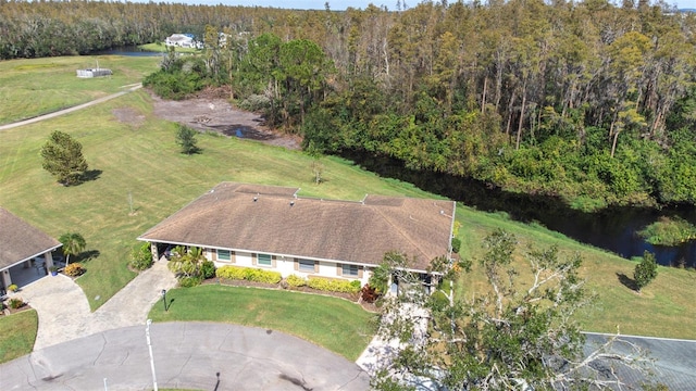 bird's eye view featuring a water view and a forest view
