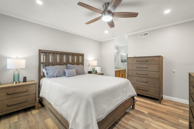 bedroom featuring connected bathroom, ceiling fan, crown molding, and light hardwood / wood-style floors