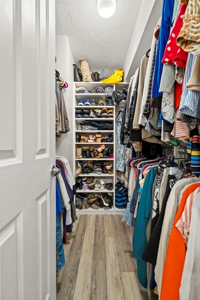 walk in closet featuring light hardwood / wood-style floors