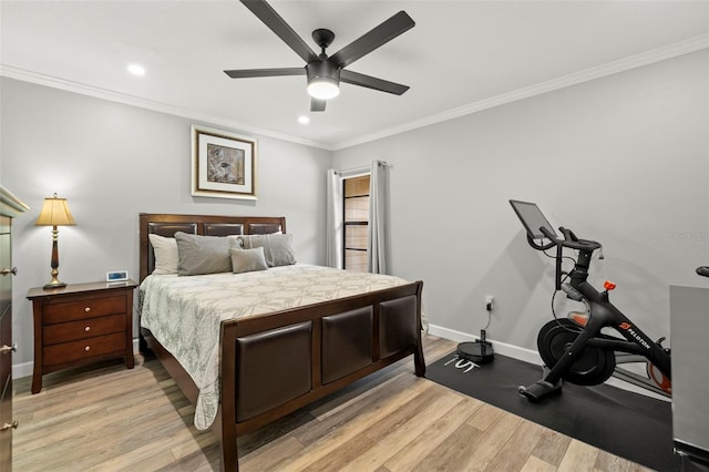 bedroom featuring ceiling fan, light hardwood / wood-style floors, and crown molding