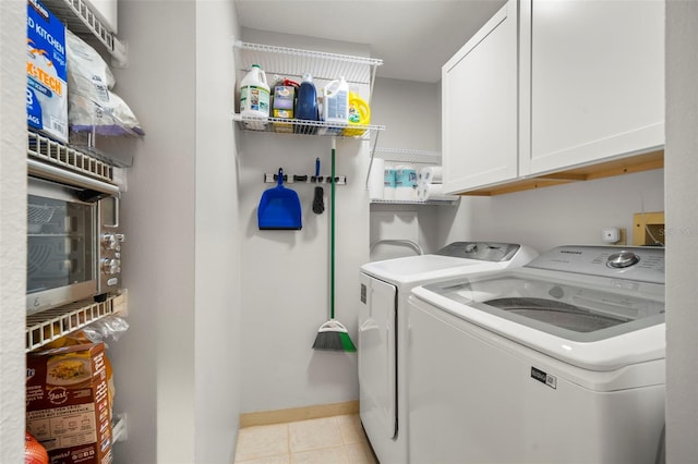 laundry area featuring cabinets and independent washer and dryer