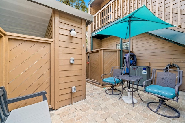 view of patio / terrace featuring a balcony and central AC