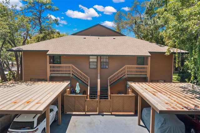 rear view of house with a carport